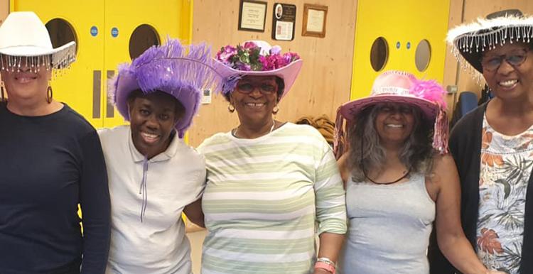 Some of the attendees at Candy's dance session showing off their hats