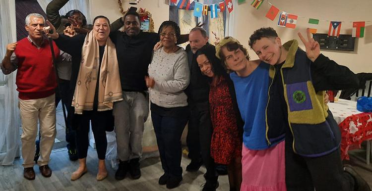 People posing for a photo at the Xmas Conversation Cafe