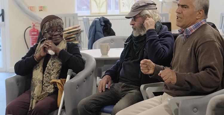 Members of the Conversation Cafe talking to each other