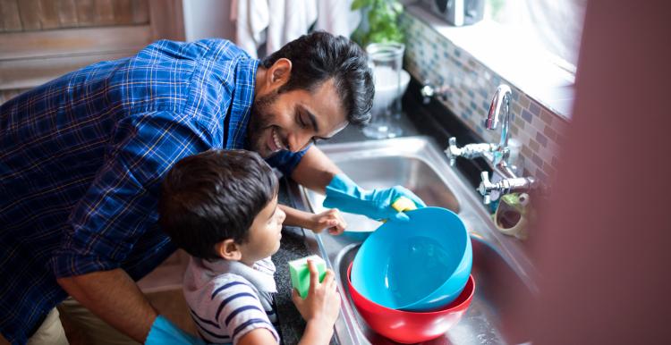 Father and child washing up