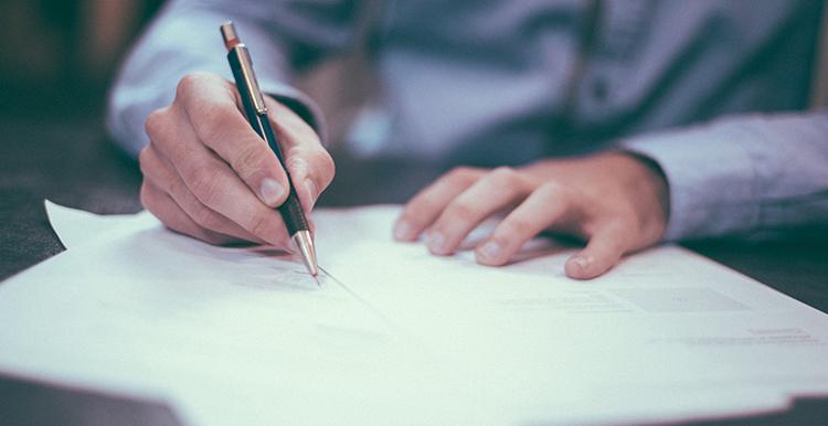 A man filling in a form