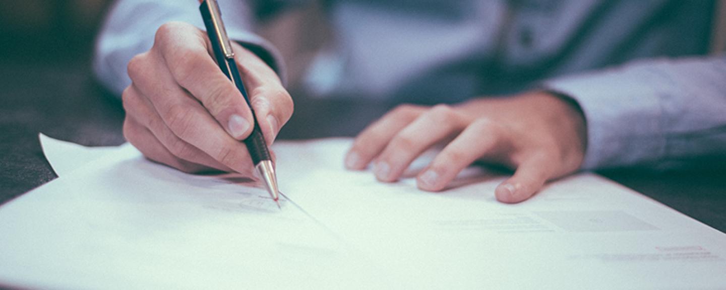 A man filling in a form