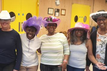 Some of the attendees at Candy's dance session showing off their hats