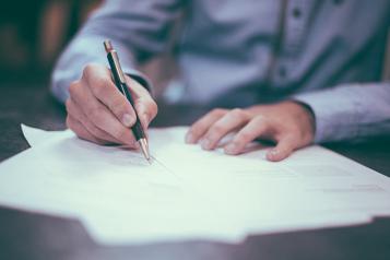 A man filling in a form