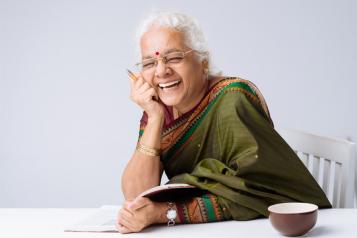 Woman Reading and Laughing