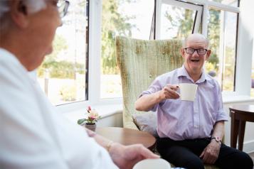 Elderly man enjoying tea  chat