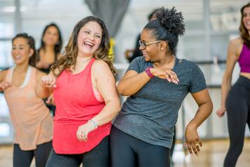 Two women in a yoga class