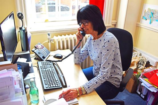 Volunteer on phone Volunteer on phone